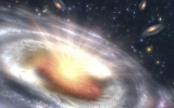 This is an artist's concept of a quasar (bright area with rays) embedded in the center of ...