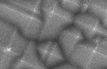 Silicon pyramid structures etched for two minutes using hydrogen fluoride/hydrogen peroxide/water solution. Resulting structure has roughness at the micro and nanometre scales, (c) C. P. Wong